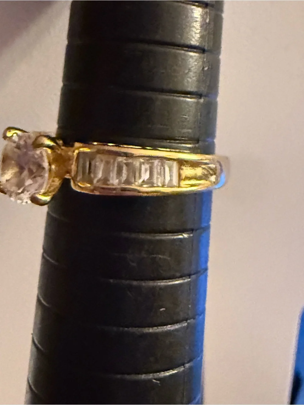 Gold tone Ring with Clear Round Center Stone and Baguette Accents